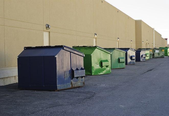 dumpsters with safety cones in a construction area in Claxton