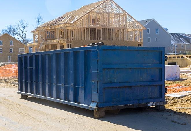 an overflowing dumpster filled with discarded home renovation materials